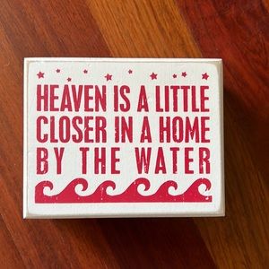 Brand new wooden sign about beach